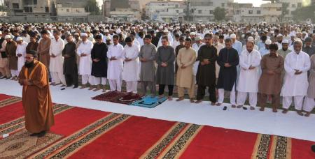MQM’s leaders, workers and a large number of people offer their Eid al-Adha prayer at the Jinnah Ground Azizabad